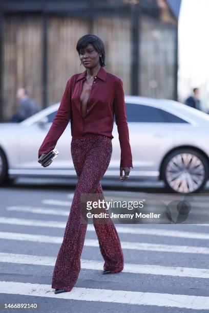 Amy Julliette Lefevre seen wearing a dark red blouse, dark red sequins pants, black heels and a clutch before the Michael Kors show on February 15,...