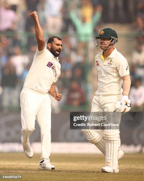Mohammed Shami of India celebrates taking the wicket of David Warner of Australia during day one of the Second Test match in the series between India...