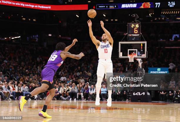 Eric Gordon of the LA Clippers puts up a three-point shot over Saben Lee of the Phoenix Suns during the second half of the NBA game at Footprint...