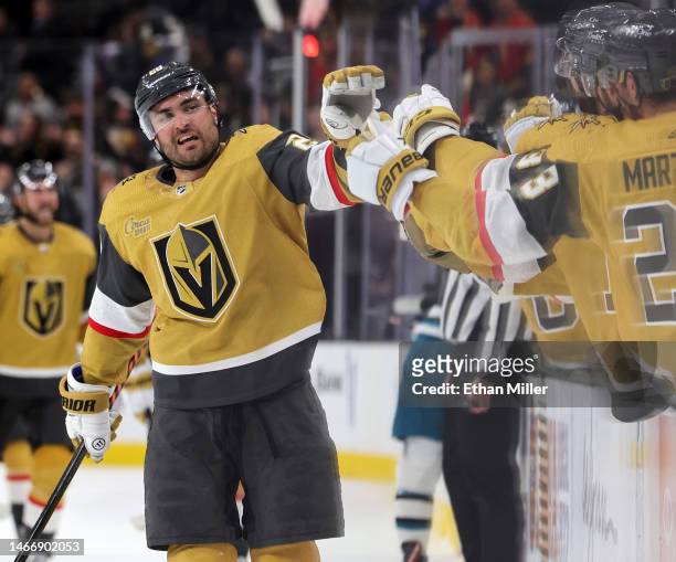William Carrier of the Vegas Golden Knights celebrates with teammates on the bench after scoring a third-period goal against the San Jose Sharks with...