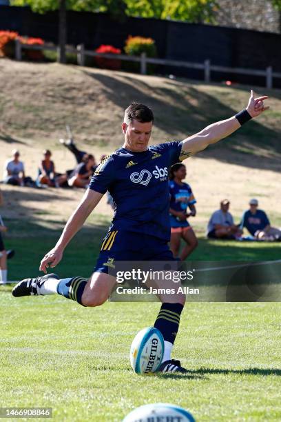 Highlanders player Freddie Burns kicks at warm up during the Super Rugby Pacific Trial Match between Highlanders and Moana Pasifika at thew...