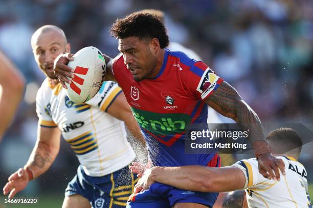 Greg Marzhew of the Knights is tackled during the NRL Trial Match between the Newcastle Knights and the Parramatta Eels at Central Coast Stadium on...