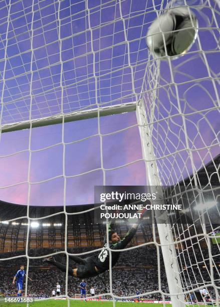 Greek goalkeeper Michalis Sifakis watches a shot speed past his goal during the Euro 2012 football championships quarter-final match Germany vs...