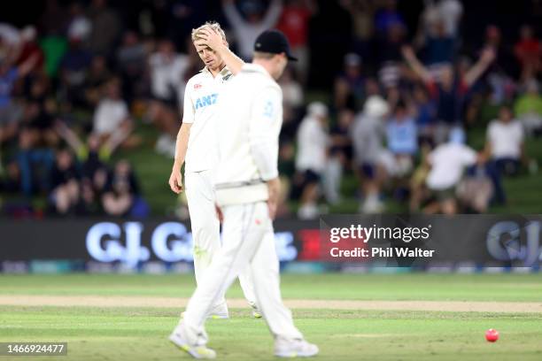 Scott Kuggeleijn of New Zealand reacts as a shot from Stuart Broad is misfielded during day two of the First Test match in the series between the New...