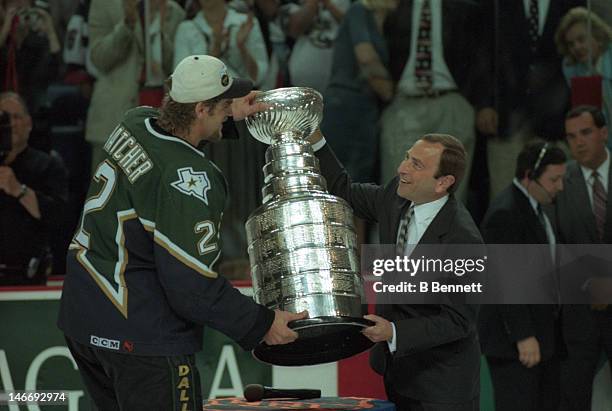 Derian Hatcher of the Dallas Stars celebrates with the Stanley Cup