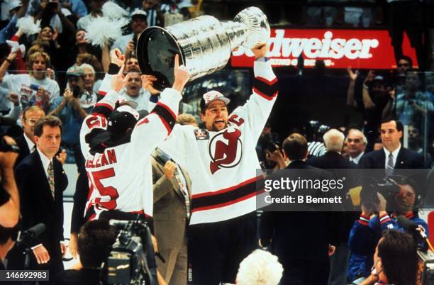 Scott Stevens of the New Jersey Devils raises the Stanley Cup after the Devils defeated the Detroit Red Wings in Game 4 of the 1995 Stanley Cup...