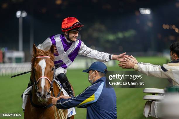 Jockey Harry Bentley gives out a high five after Splendid Living winning the Race 4 Sai Kung Handicap at Happy Valley Racecourse on February 15, 2023...