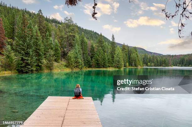 tourist enjoying a hiking break in valley of the five lakes hike- jasper national park canada - jasper stock pictures, royalty-free photos & images
