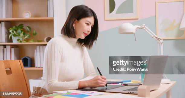 asian soho designer - design studio woman chinese laptop stock pictures, royalty-free photos & images