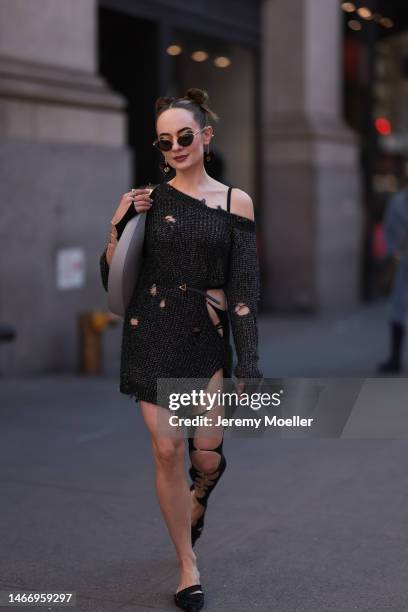 Katya Bychkova seen wearing Gucci sunglasses with heart shaped chain details, NBD dark grey off-shoulder knit sweater dress with cut-outs, NAEITA...