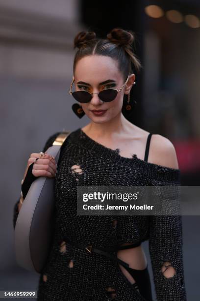 Katya Bychkova seen wearing Gucci sunglasses with heart shaped chain details, NBD dark grey off-shoulder knit sweater dress with cut-outs, NAEITA...