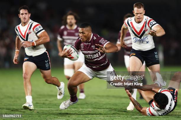 Samuela Fainu of the Sea Eagles is tackled during the NRL Trial Match between the Sydney Roosters and the Manly Sea Eagles at Central Coast Stadium...