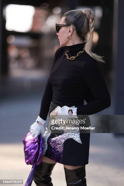 Olga Ferrara seen wearing black sunglasses, gold statement chain necklace, gold earrings, Fallonandava black turtleneck, Seymoure white leather pearl...