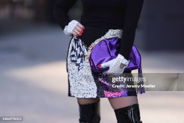 Olga Ferrara seen wearing Fallonandava black turtleneck, Seymoure white leather pearl pattern gloves, Phillip Lim black with purple sequins pattern...