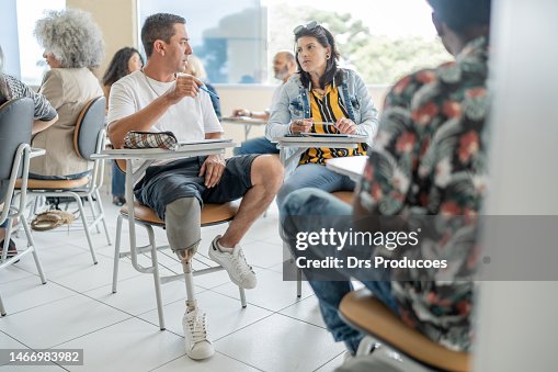 One Leg Student College Student With Prosthetic Leg In College Classroom High-Res Stock ...