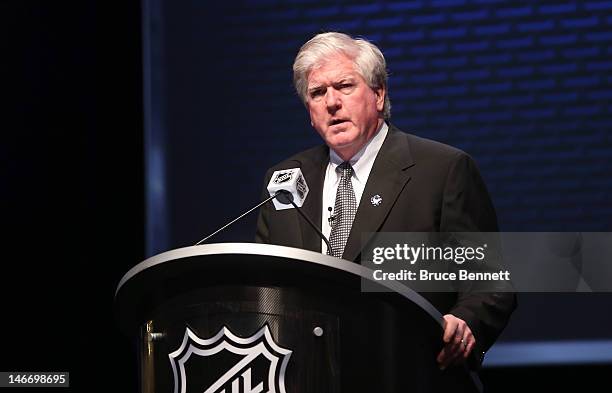 General manager Brian Burke of the Toronto Maple Leafs speaks on stage during Round One of the 2012 NHL Entry Draft at Consol Energy Center on June...
