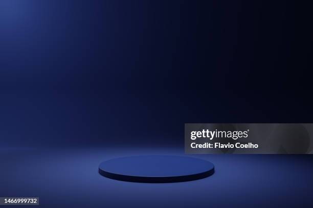 blue backdrop with round stage - blue studio stock-fotos und bilder