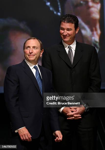 Commissioner Gary Bettman speaks with Co-Owner of the Pittsburgh Penguins Mario Lemieux during Round One of the 2012 NHL Entry Draft at Consol Energy...