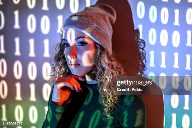 binary machine code. beautiful young woman is in projector neon lights in the studio - projection equipment stock pictures, royalty-free photos & images