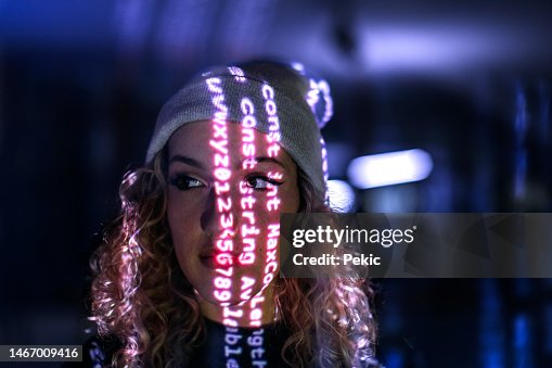 Computer code projected on young woman's face Computer code projected on young woman's face