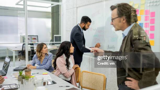 corporate employees generating ideas and brainstorming in conference room - scrum 個照片及圖片檔