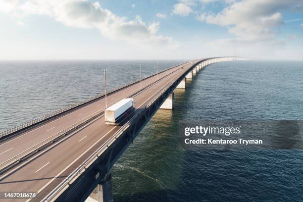 aerial view of a bridge over water. - driving sun stockfoto's en -beelden