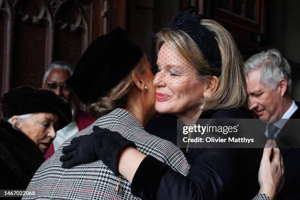 Queen Mathilde of Belgium welcomes Princess Claire at the annual mass in memory of deceased members of the Royal Family in the Notre-Dame de Laeken...