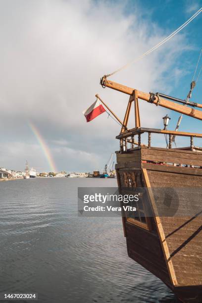 saint malo port with picturesque rainbow and wooden pirate galleon - galeone foto e immagini stock