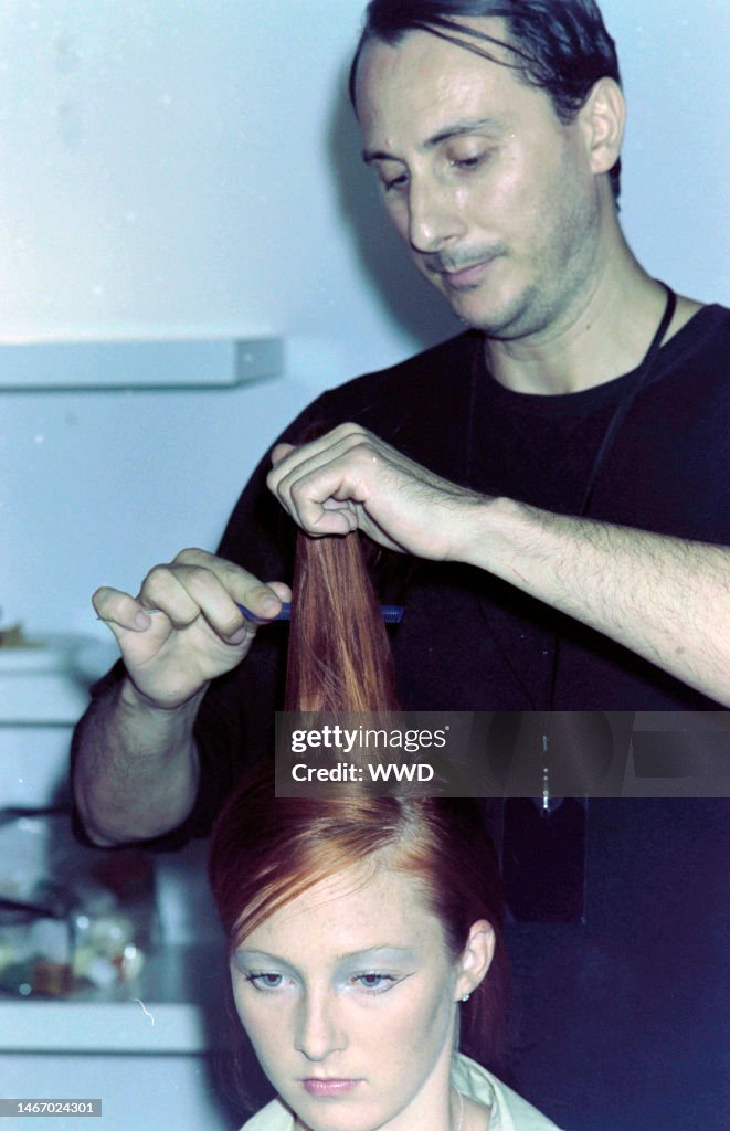 Model Maggie Rizer gets her hair done before the show. News Photo ...