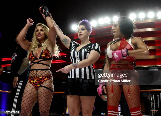 Referee Sarah Wolfe raises the arm of Sheena "The Hungarian Hurricane" Bathory after her victory over Bella "Rebel Princess" Madisyn during "Lingerie...