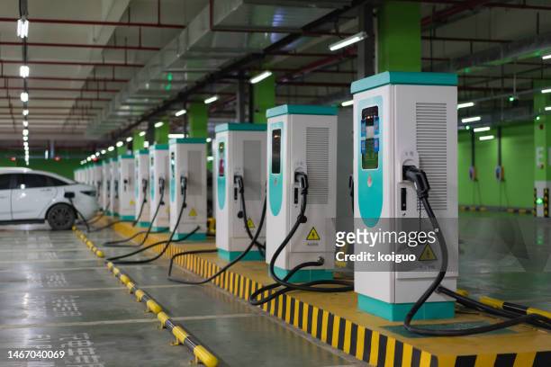 electric vehicle supercharging station - alternative fuel vehicle stock pictures, royalty-free photos & images