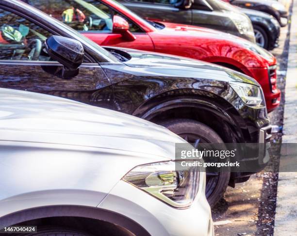 cars parked in a row - car parked stock pictures, royalty-free photos & images