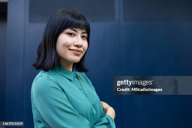 portrait of confident young woman - teal stock pictures, royalty-free photos & images