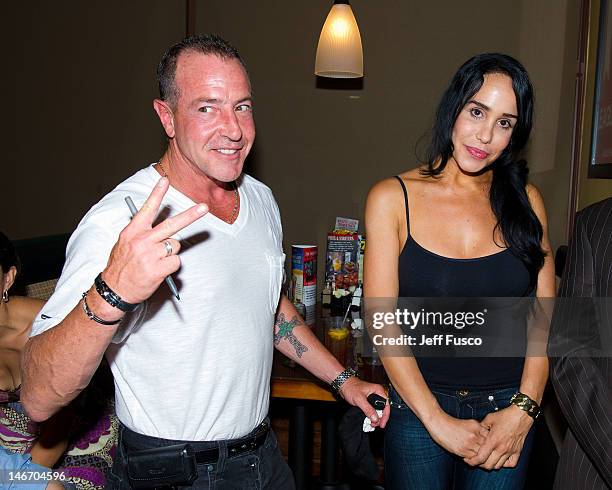 Michael Lohan and Nadya 'Octomom' Suleman pose at the Celebrity Pillow Fight Press Conference and Weigh In at the Fox And Hound Pub and Grille on...