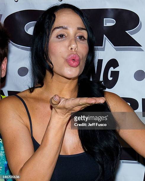 Nadya 'Octomom' Suleman blows a kiss at the Celebrity Pillow Fight Press Conference and Weigh In at the Fox And Hound Pub and Grille on June 22, 2012...