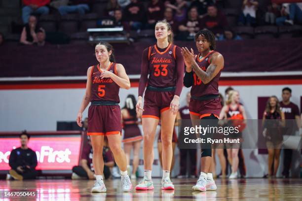 Georgia Amoore, Elizabeth Kitley, Taylor Soule of the Virginia Tech Hokies look on in the second half of a game against the Duke Blue Devils at...