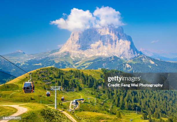 langkofel mountain and cable car to gardena pass, dolomites, south tyrol, italy - selva alto adige stock pictures, royalty-free photos & images