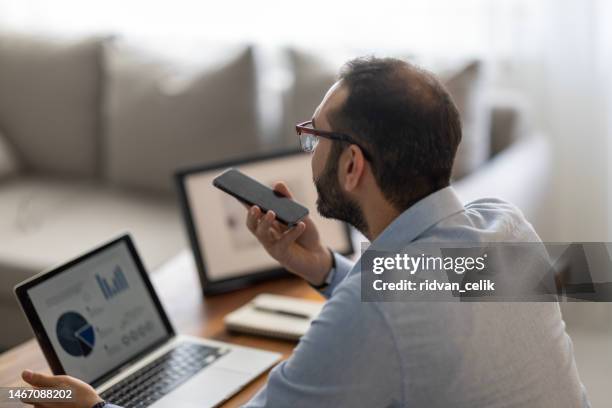 man holding loudspeaker conversation. - voice activated stock pictures, royalty-free photos & images