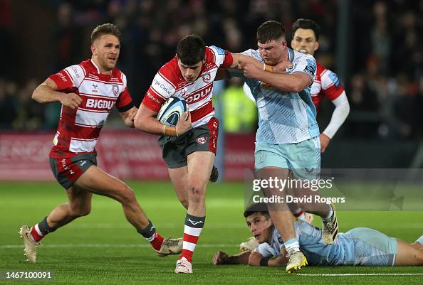 Akinson Rugby Seb Atkinson of Gloucester holds off Jack Musk as he charges upfield ...