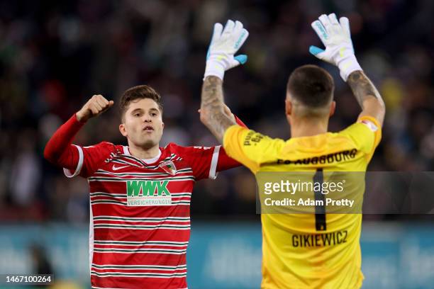 Elvis Rexhbecaj and Rafal Gikiewicz celebrates after his team mate score their first side goa during the Bundesliga match between FC Augsburg and TSG...