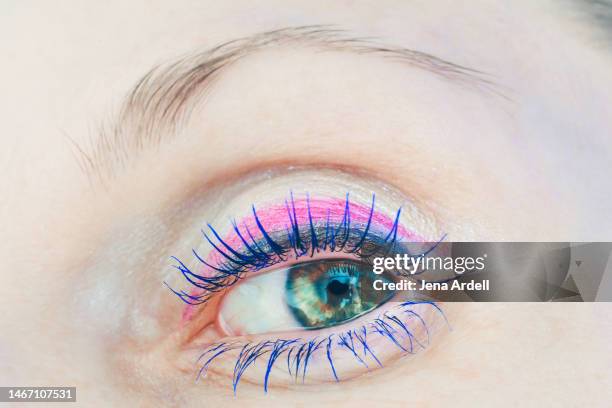 blue mascara long eyelashes colorful eye makeup: eyeliner and eyeshadow, thin eyebrows - colorful eye liner stock pictures, royalty-free photos & images