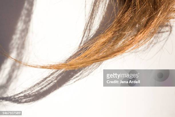 dry hair with split ends, summer hair problems, damaged hair closeup - damaged hair stock pictures, royalty-free photos & images