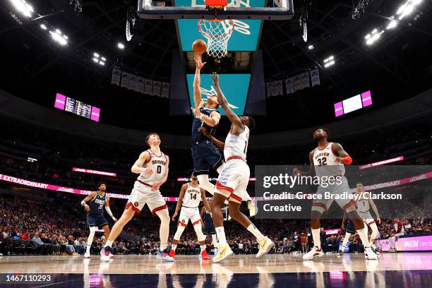 Dwight Powell of the Dallas Mavericks shoots against the Denver Nuggets during the second half of the game at Ball Arena on February 15, 2023 in...