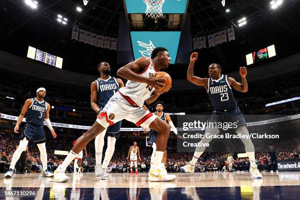 Thomas Bryant of the Denver Nuggets drives against McKinley Wright IV of the Dallas Mavericks during the second half of the game at Ball Arena on...