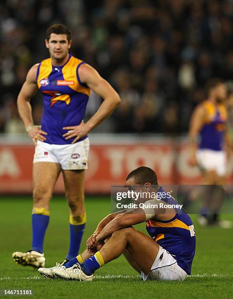 Jack Darling and Daniel Kerr of the Eagles look dejected after losing the round 13 AFL match between the Collingwood Magpies and the West Coast...