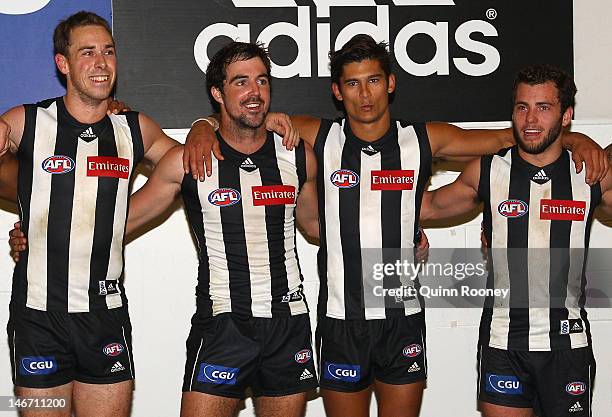 Nick Maxwell, Steele Sidebottom, Sharrod Wellingham and Jarryd Blair of the Magpies sing the song in the rooms after winning the round 13 AFL match...