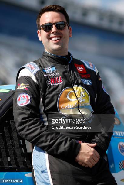 Timmy Hill, driver of the Coble Enterprises Toyota, waits on the grid during qualifying for the NASCAR Craftsman Truck Series NextEra Energy 250 at...