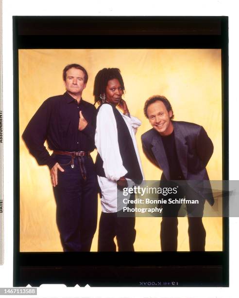 Comedians Robin Williams, Whoopi Goldberg and Billy Crystal pose together for Comic Relief in Los Angeles in 1994.