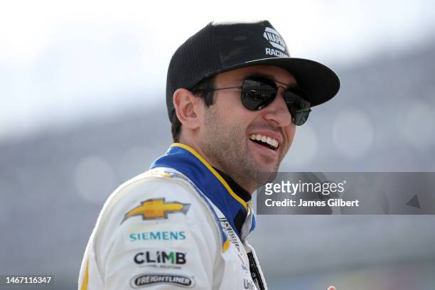 Chase Elliott, driver of the Gates Hydraulics Chevrolet, waits on the grid during qualifying for the NASCAR Craftsman Truck Series NextEra Energy 250...