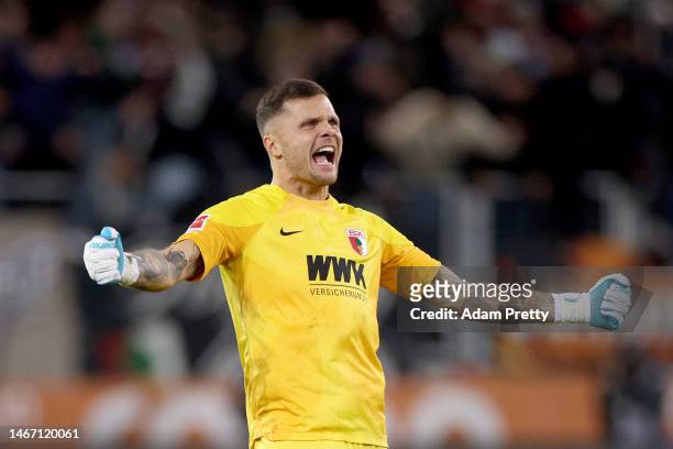Rafal Gikiewicz FC Augsburg celebrates during the Bundesliga match between FC Augsburg and TSG Hoffenheim at WWK-Arena on February 17, 2023 in...
